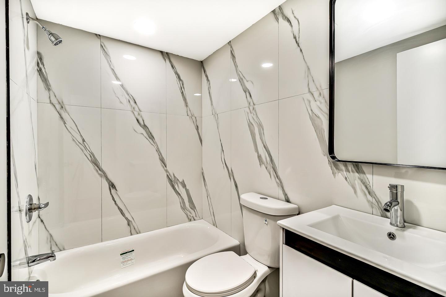 182 East Huntingdon Street Philadelphia, PA 19125 - Photo 33 of 41 a bathroom with a sink a toilet and shower