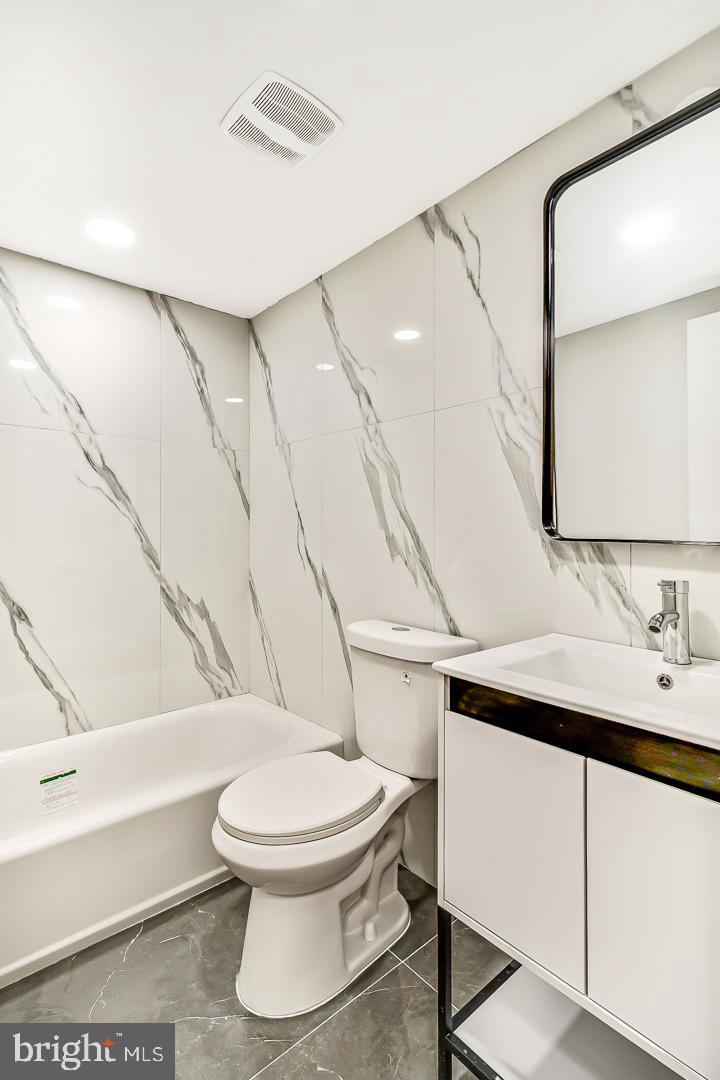 182 East Huntingdon Street Philadelphia, PA 19125 - Photo 34 of 41 a bathroom with a toilet sink and mirror