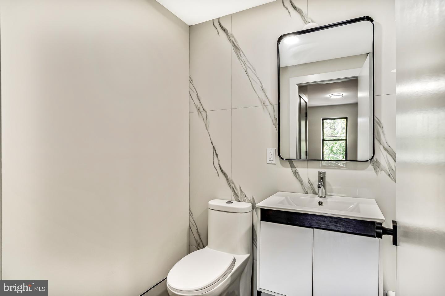 182 East Huntingdon Street Philadelphia, PA 19125 - Photo 38 of 41 a bathroom with a sink toilet and mirror