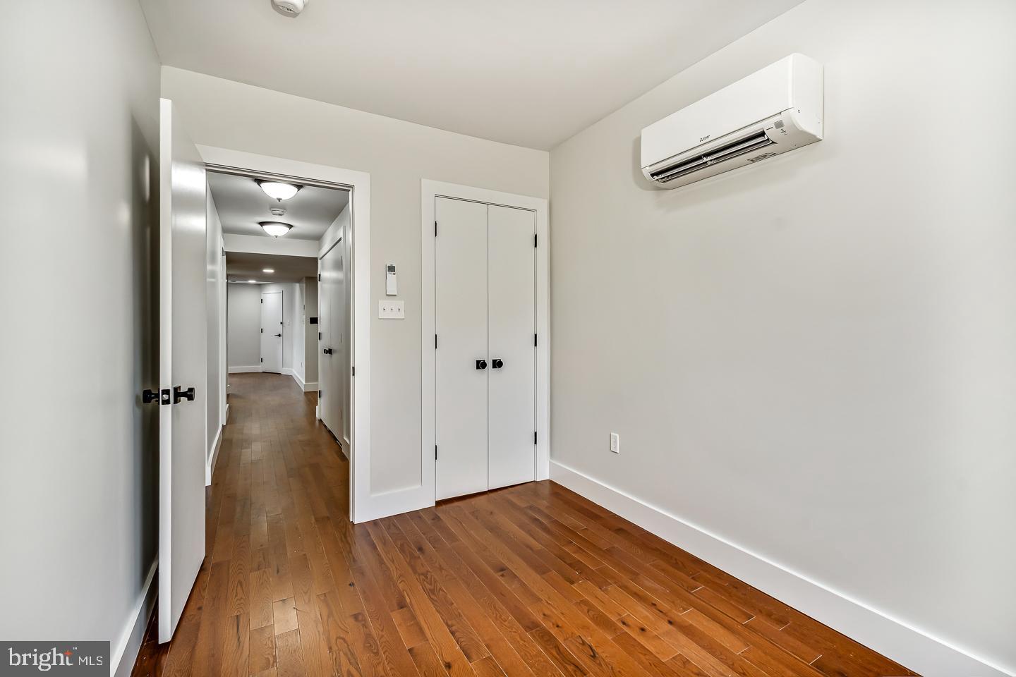 182 East Huntingdon Street Philadelphia, PA 19125 - Photo 41 of 41 wooden floor in a hall with an empty room
