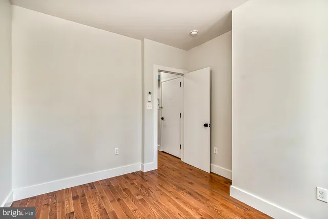 a bathroom with a toilet and a bathtub