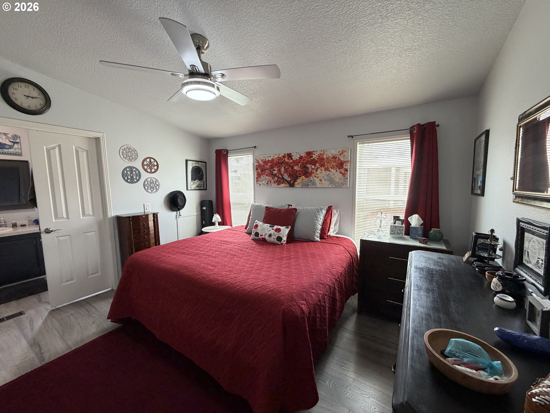 1699 North Terry Street, Unit 351 Eugene, OR 97402 - Photo 8 of 23 a bedroom with a bed and a chandelier