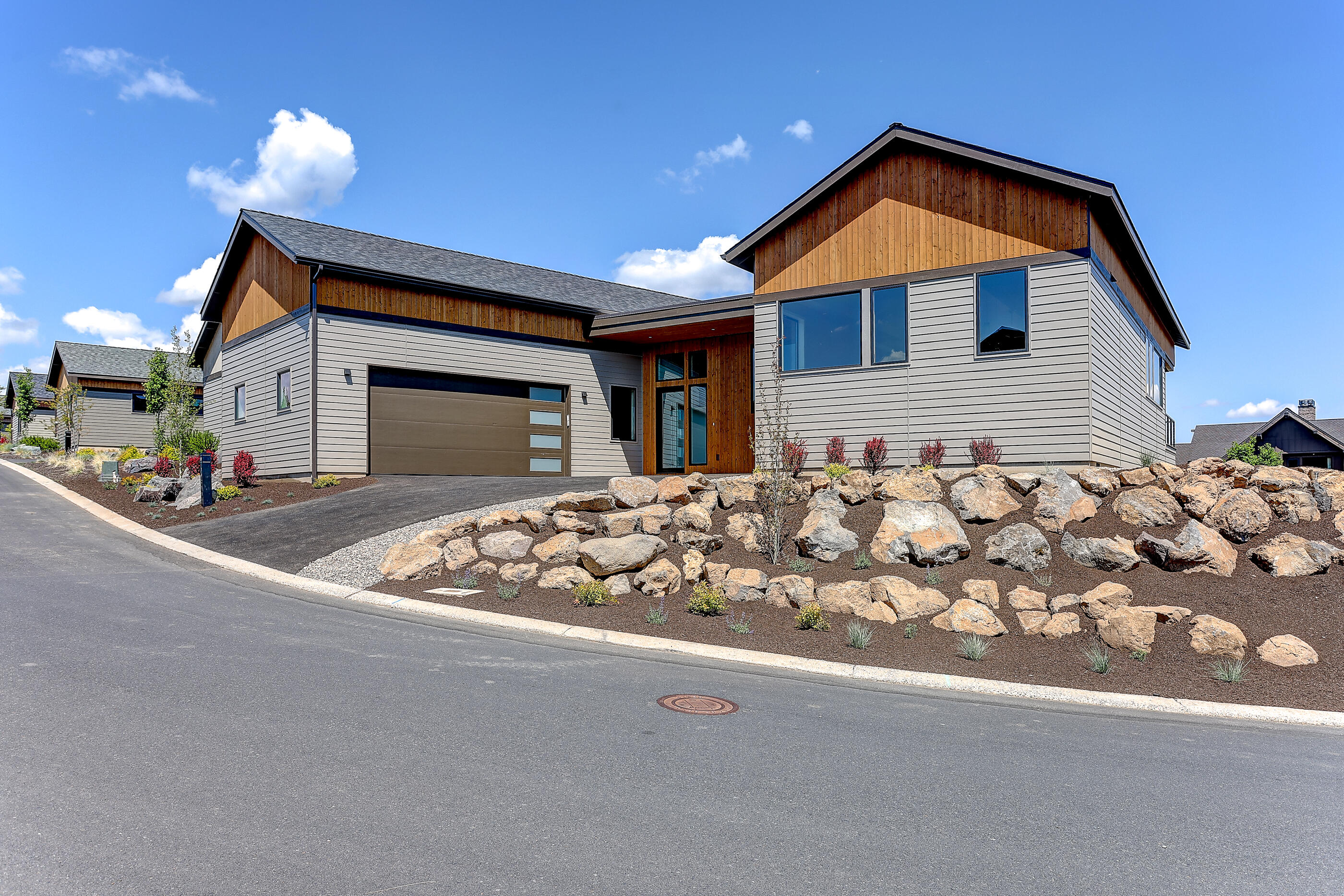 Elevated corner lot across from the Tetherow clubhouse and pool.