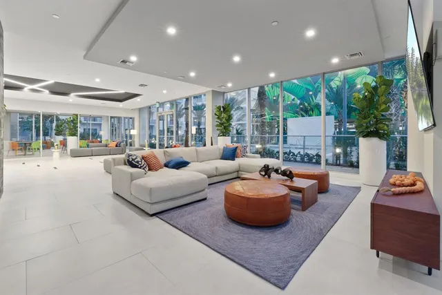 a living room with furniture and a large window