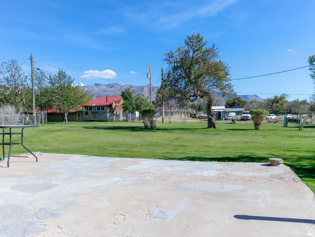155 West Center Street Fillmore, UT 84631 - Photo 65 of 86 Expansive green lawn with mature trees and a concrete patio