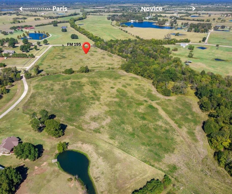 43375 Tract 1 Paris, TX 75462 - Photo 5 of 5 a blue swimming pool is in the middle of a lake