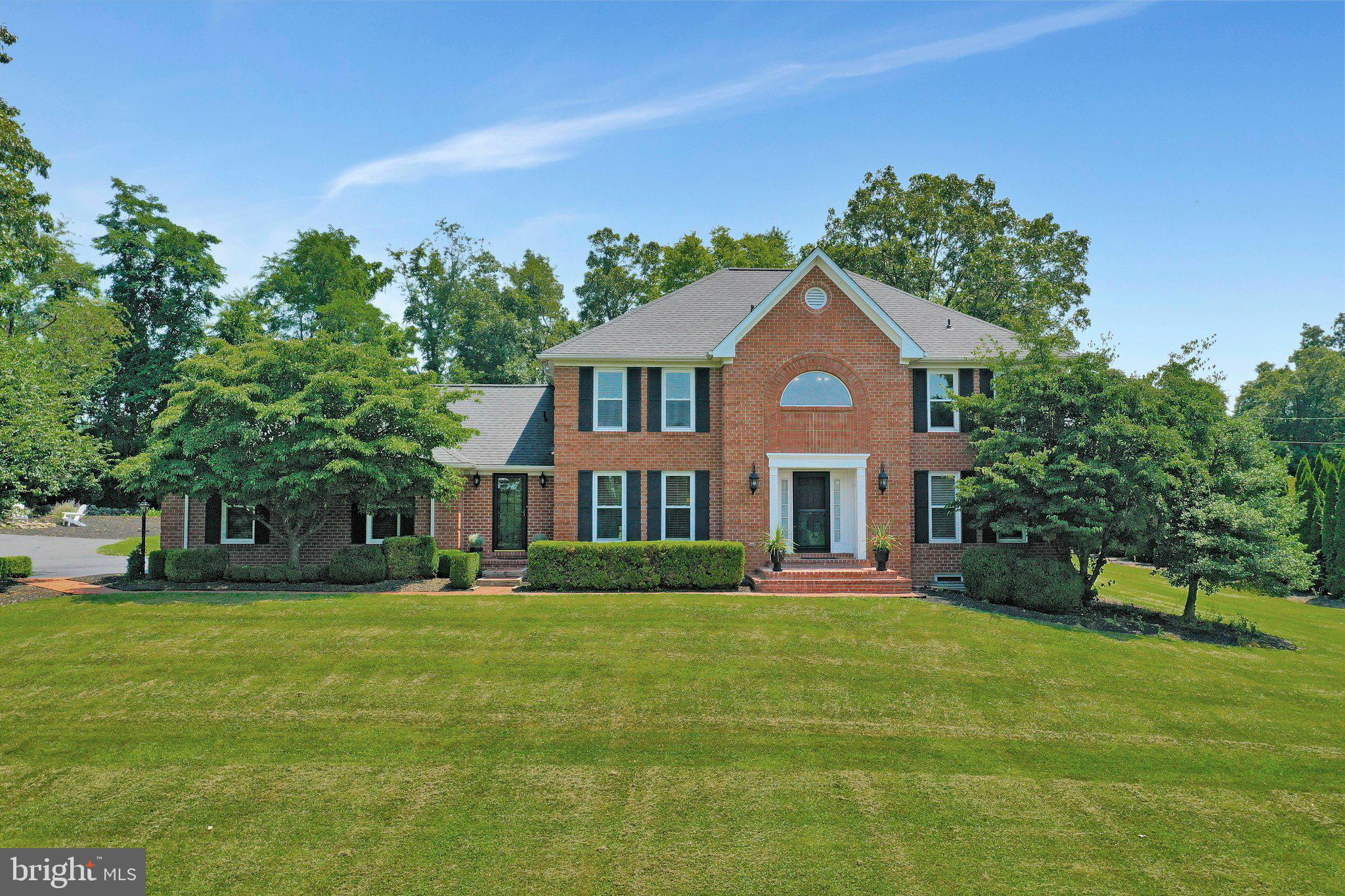 7845 Ridge Road Frederick, MD 21702 - Photo 1 of 67 a front view of a house with a yard