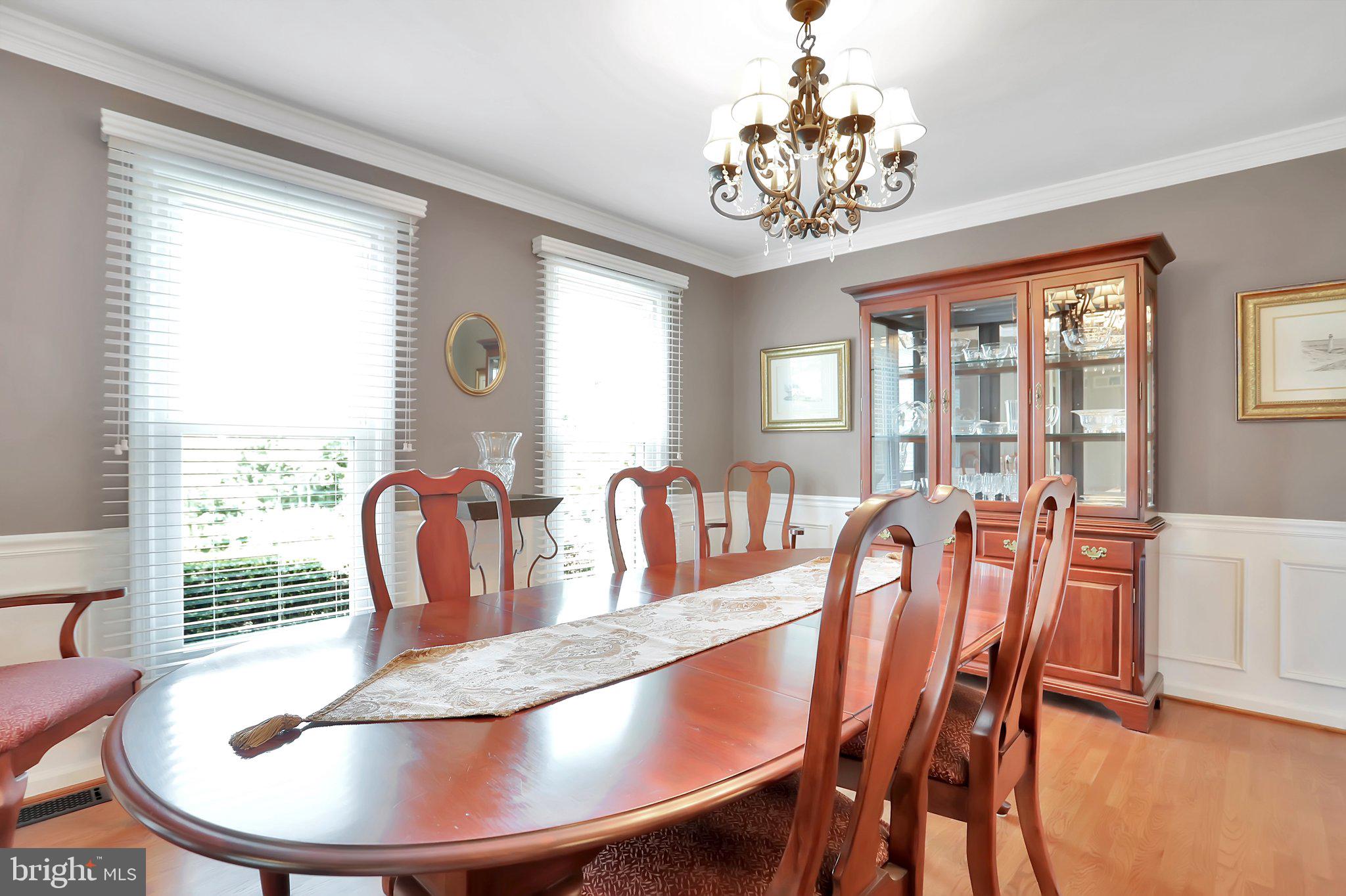 7845 Ridge Road Frederick, MD 21702 - Photo 12 of 67 a dining room with furniture a large window and wooden floor