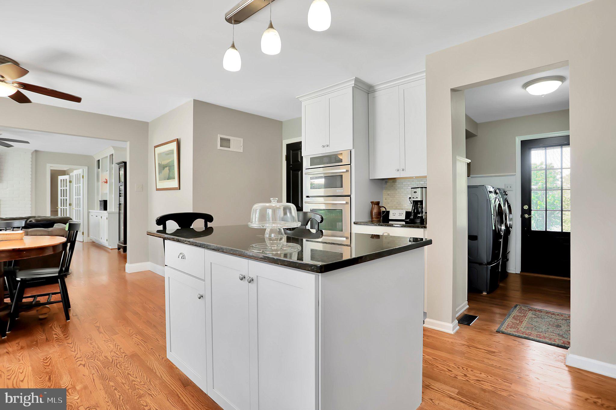 7845 Ridge Road Frederick, MD 21702 - Photo 28 of 67 a kitchen with stainless steel appliances kitchen island granite countertop a sink and cabinets