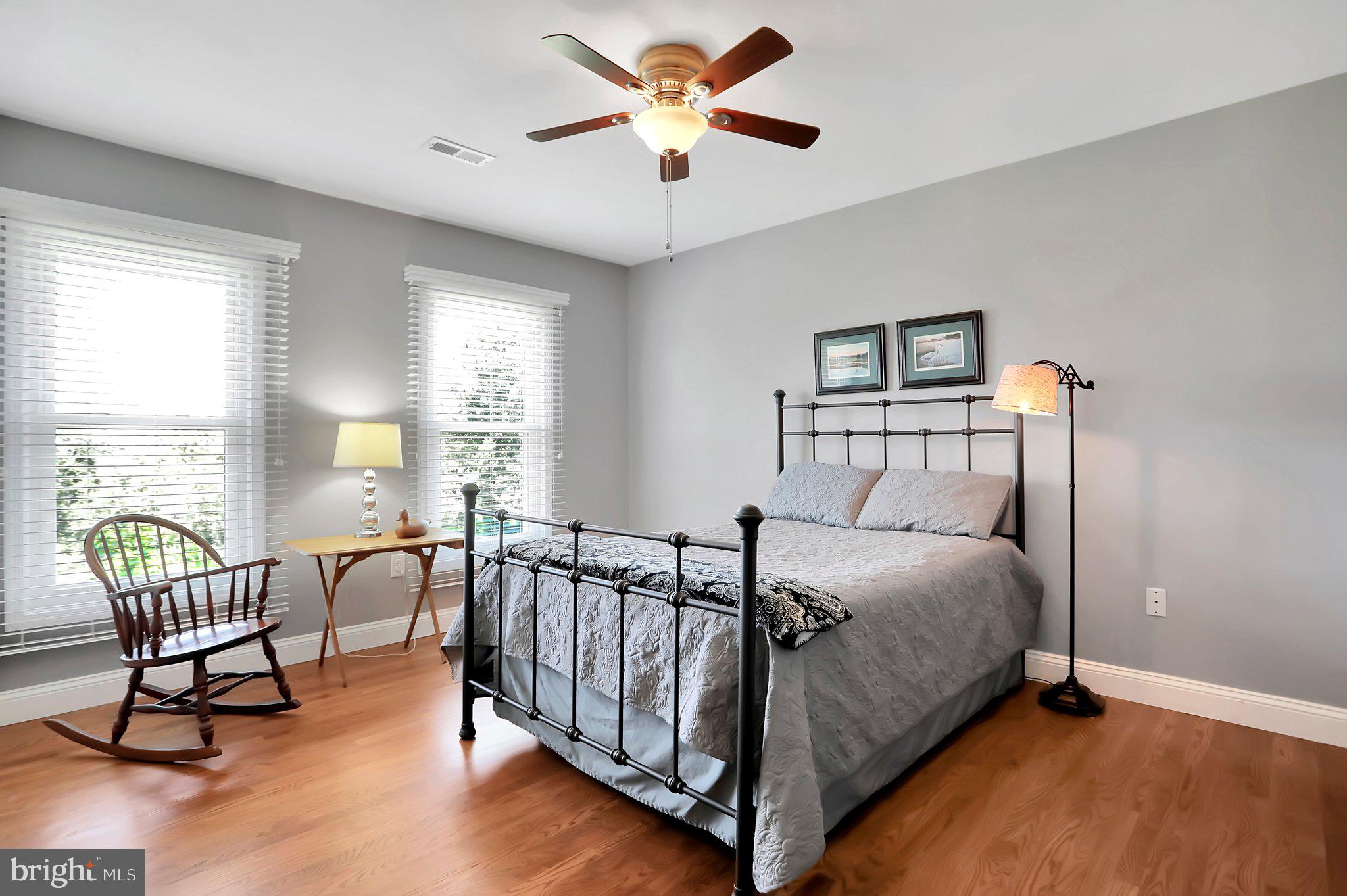 7845 Ridge Road Frederick, MD 21702 - Photo 30 of 67 a bed room with a bed and a lounge chair