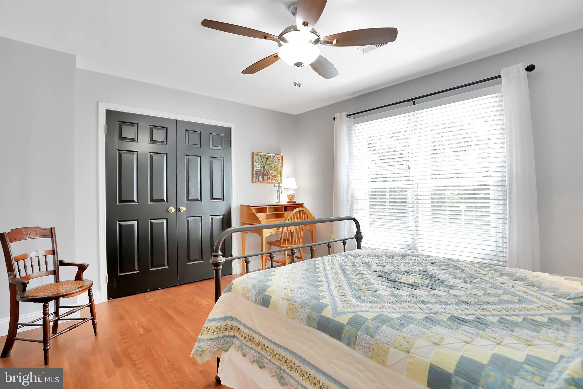 7845 Ridge Road Frederick, MD 21702 - Photo 38 of 67 a bedroom with a bed and a chandelier