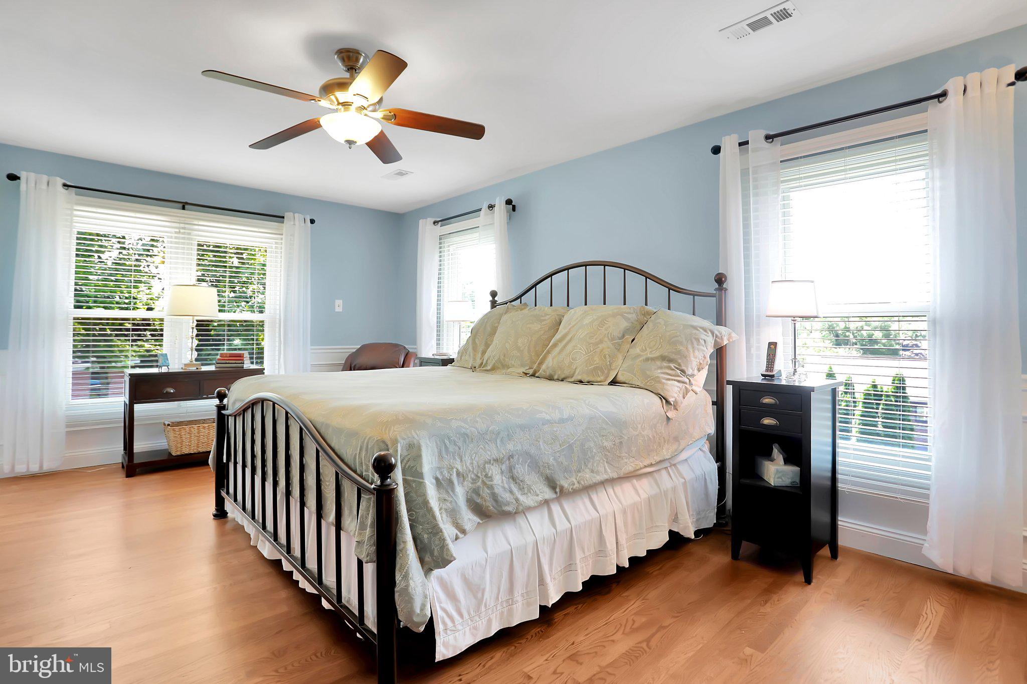 7845 Ridge Road Frederick, MD 21702 - Photo 40 of 67 a bedroom with a large bed and a chandelier