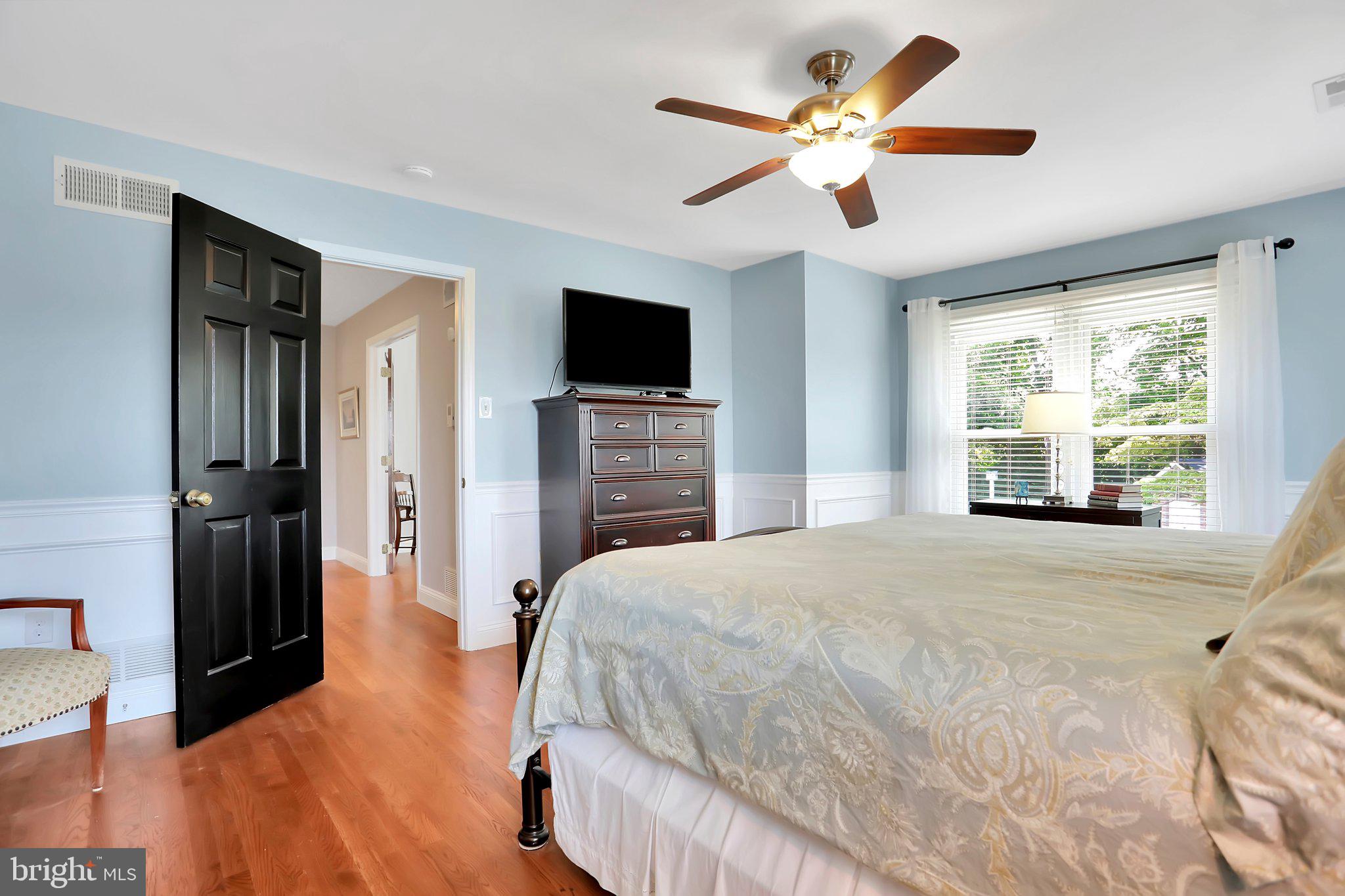 7845 Ridge Road Frederick, MD 21702 - Photo 41 of 67 a bedroom with a bed and a flat screen tv
