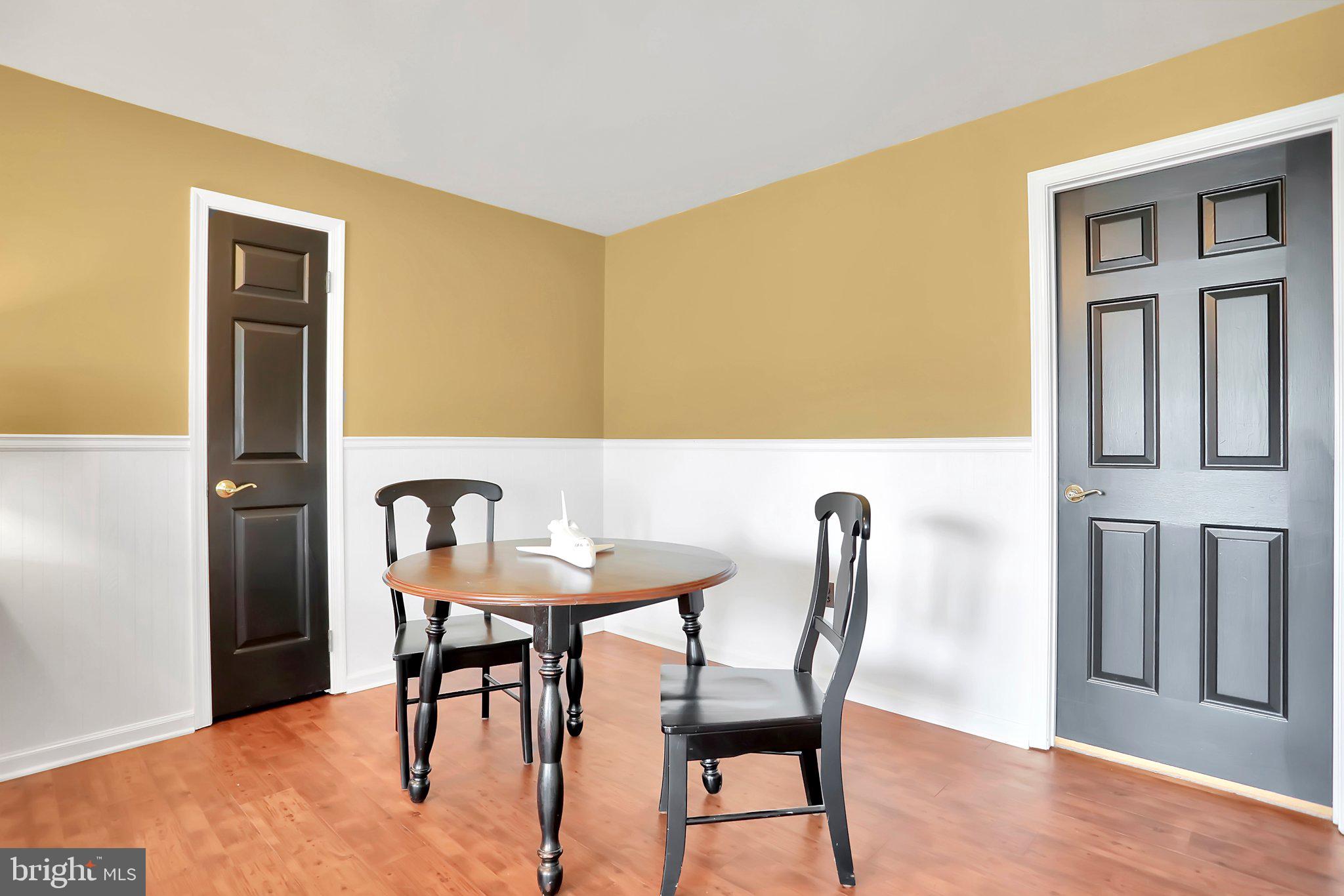 7845 Ridge Road Frederick, MD 21702 - Photo 49 of 67 a view of a dining room with furniture and wooden floor