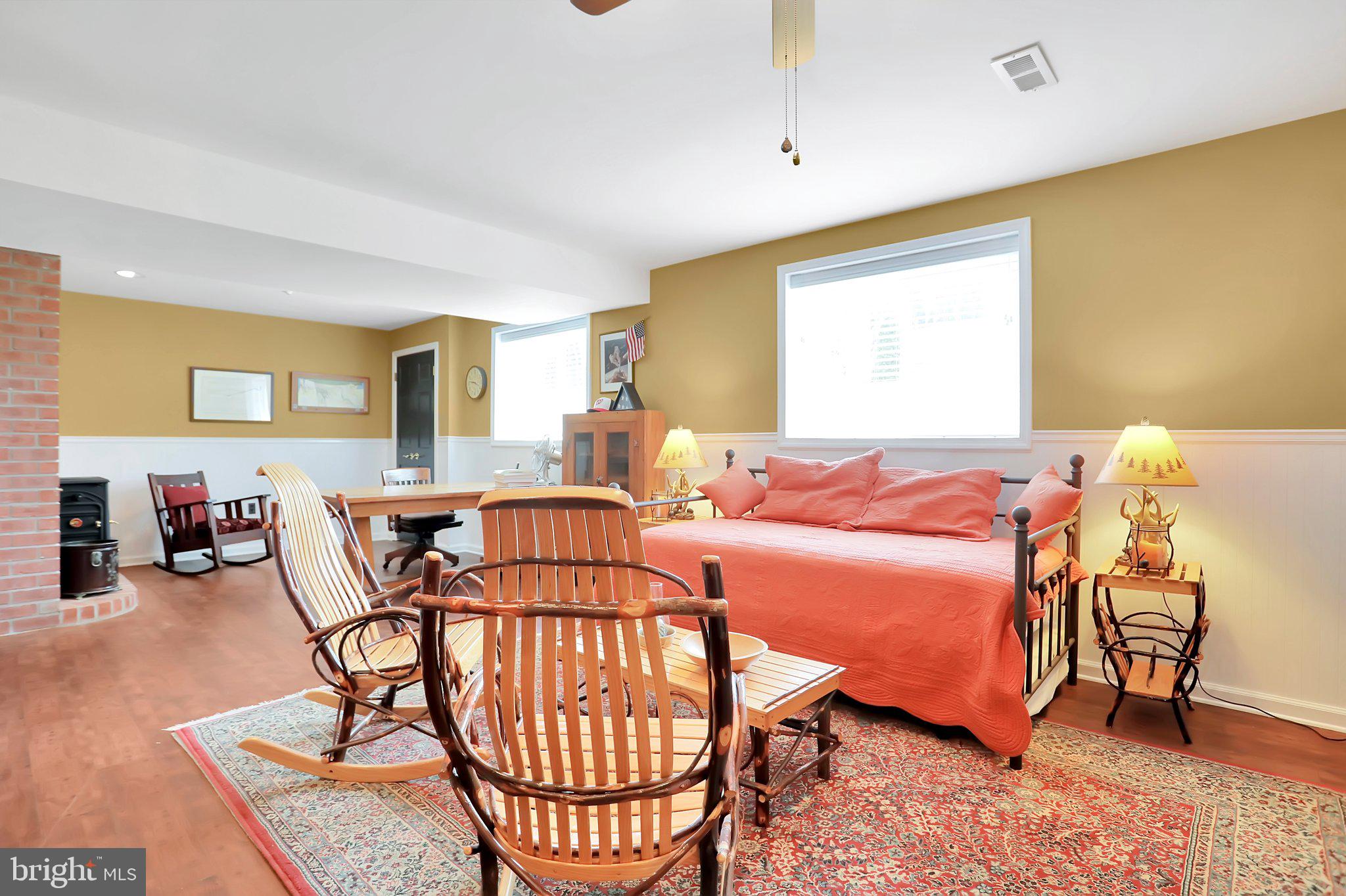 7845 Ridge Road Frederick, MD 21702 - Photo 50 of 67 a bedroom with a bed a table and chair