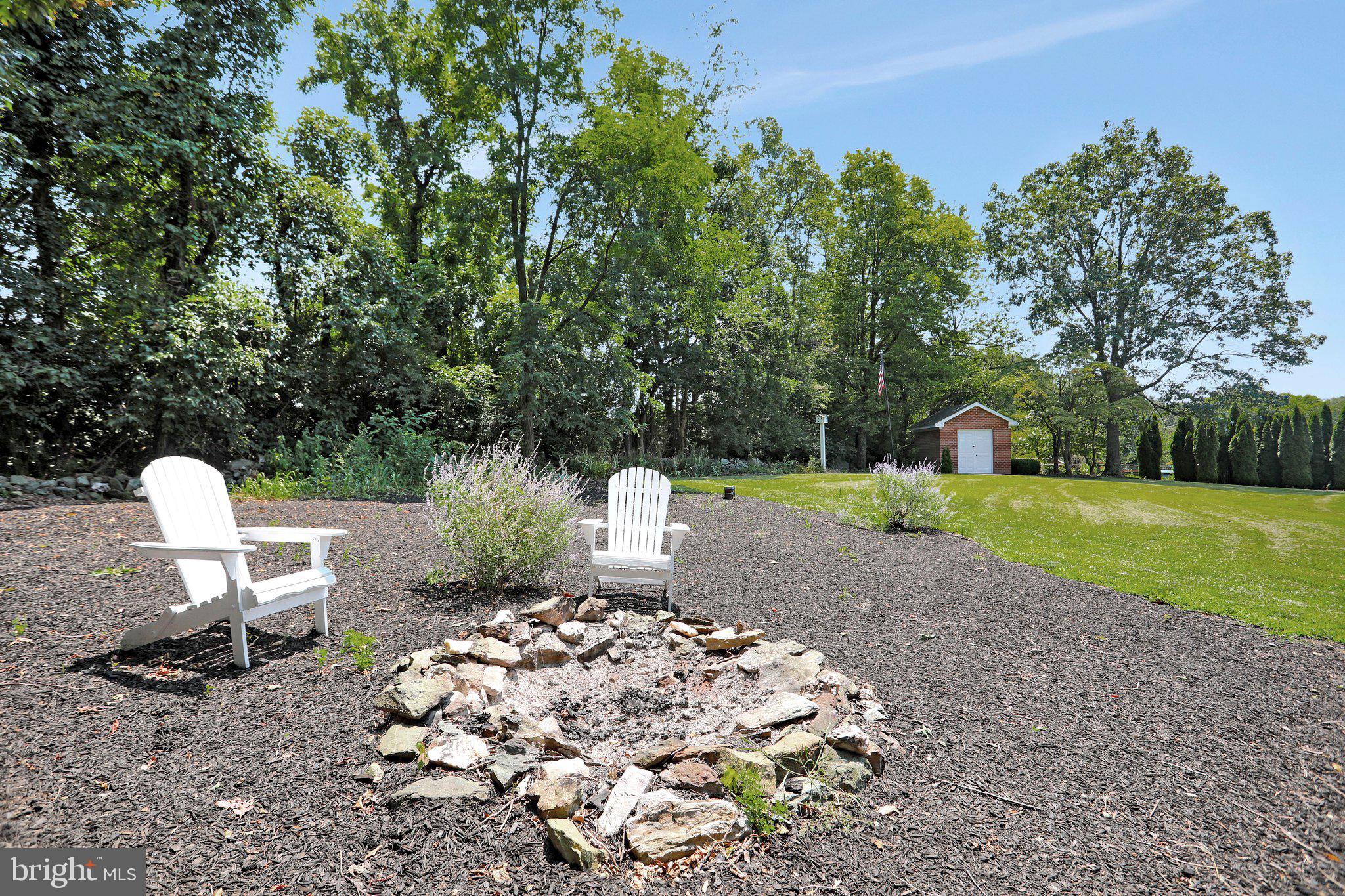 7845 Ridge Road Frederick, MD 21702 - Photo 63 of 67 a view of a backyard with table and chairs a barbeque grill and plants