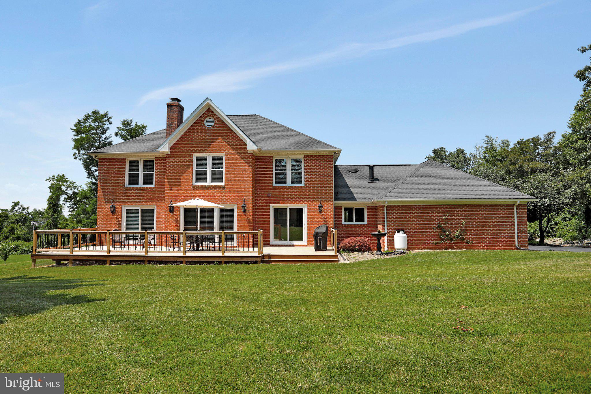 7845 Ridge Road Frederick, MD 21702 - Photo 64 of 67 a front view of a house with a yard and trees