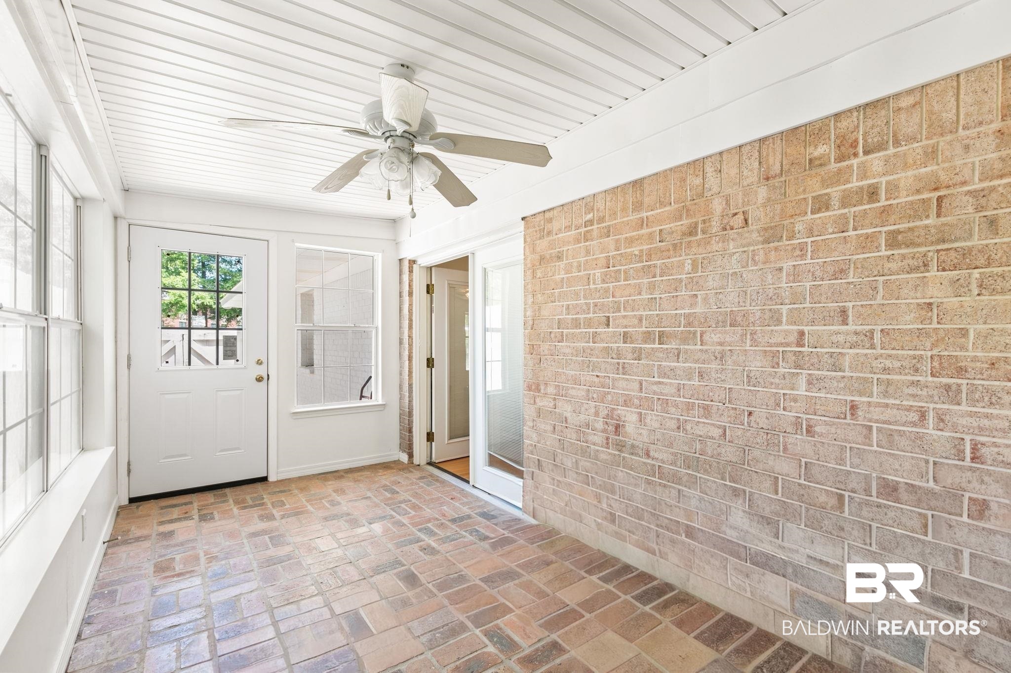 927 Cleveland Road Saraland, AL 36571 - Photo 35 of 80 Enclosed porch featuring brick flooring, a white paneled ceiling, and a ceiling fan