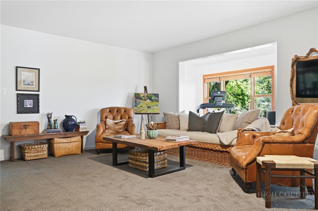 165 All Hallows Road Boone, NC 28607 - Photo 29 of 50 a living room with furniture and a flat screen tv