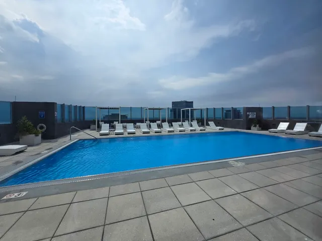 a view of swimming pool with outdoor seating