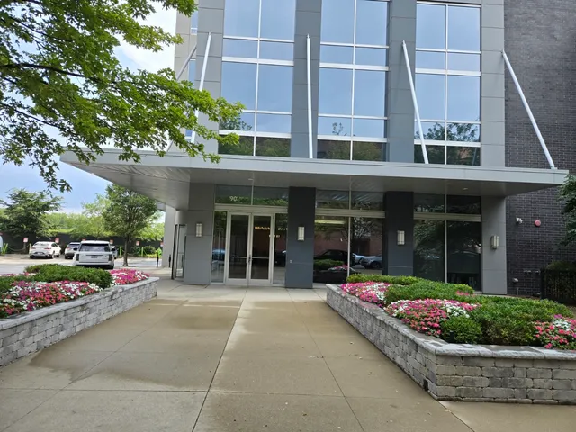 a view of a building with sitting area