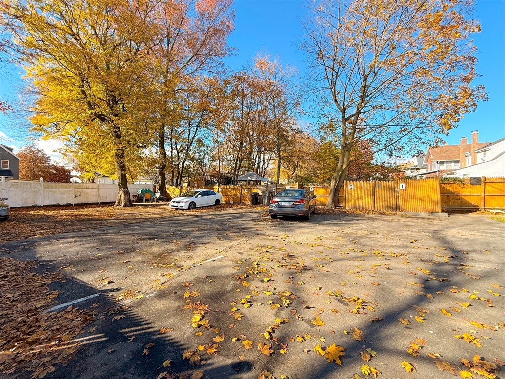 39 Pond Street, Unit 2 Framingham, MA 01702 - Photo 17 of 18 a view of road with large trees