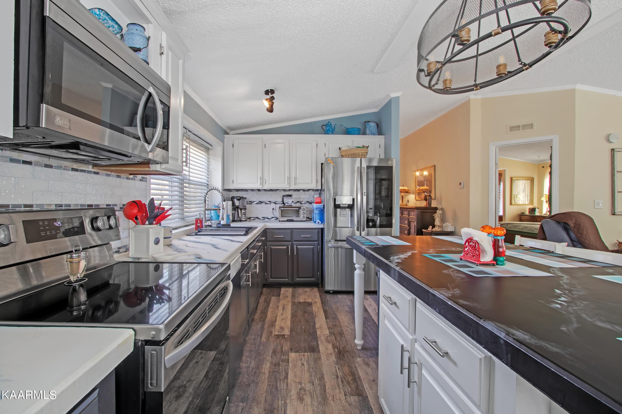 4981 Malone Road Loudon, TN 37774 - Photo 24 of 35 a kitchen with stainless steel appliances granite countertop a sink dishwasher stove and oven