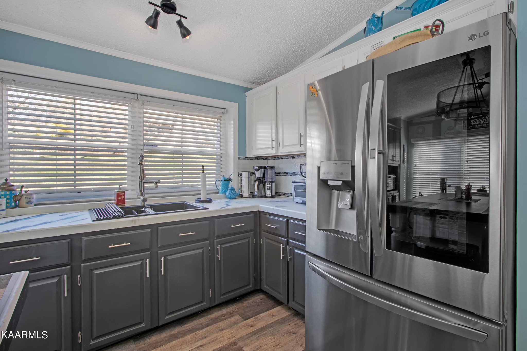 4981 Malone Road Loudon, TN 37774 - Photo 25 of 35 a kitchen with stainless steel appliances a sink cabinets and a window