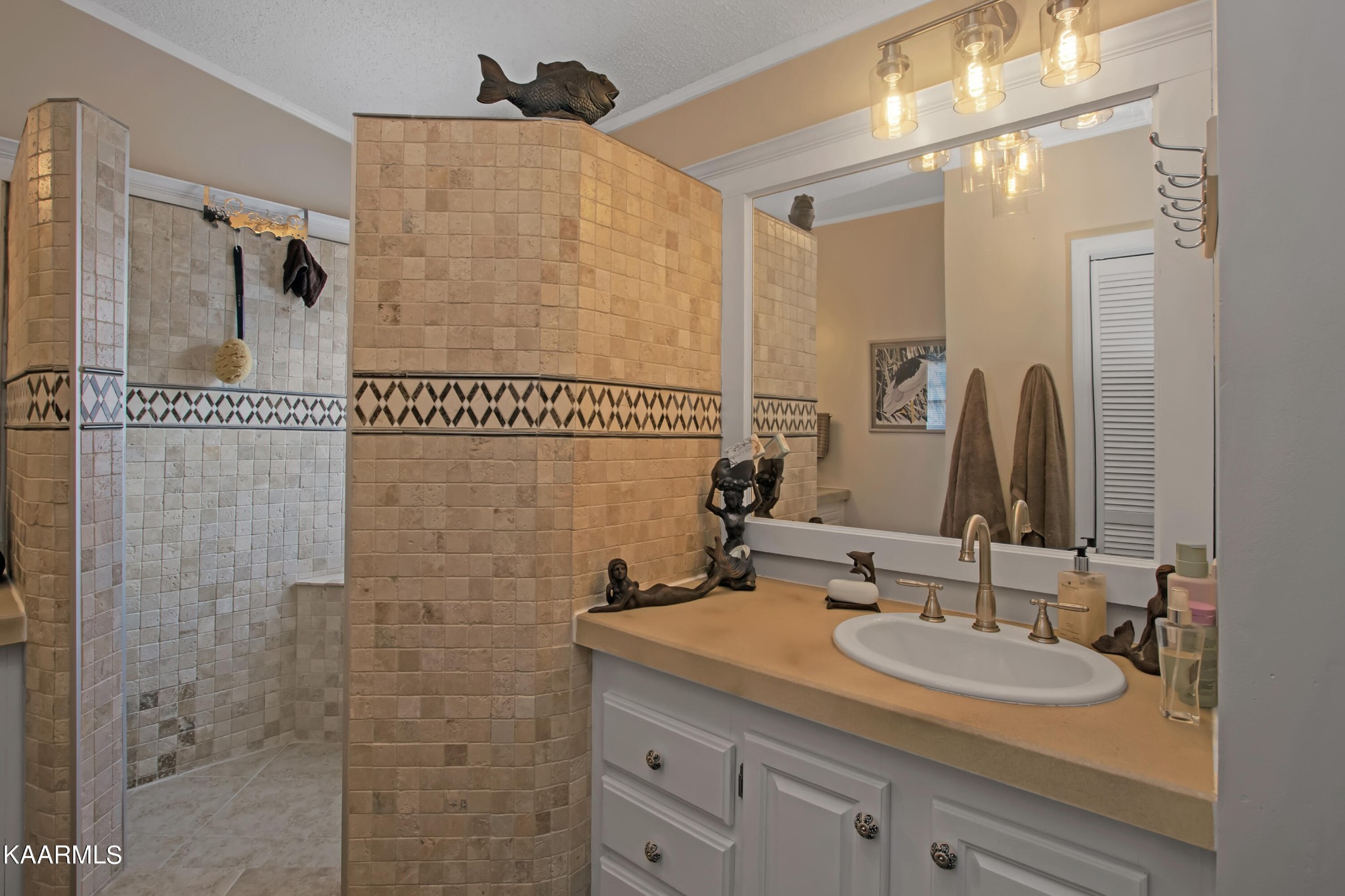 4981 Malone Road Loudon, TN 37774 - Photo 30 of 35 a bathroom with a shower sink and mirror