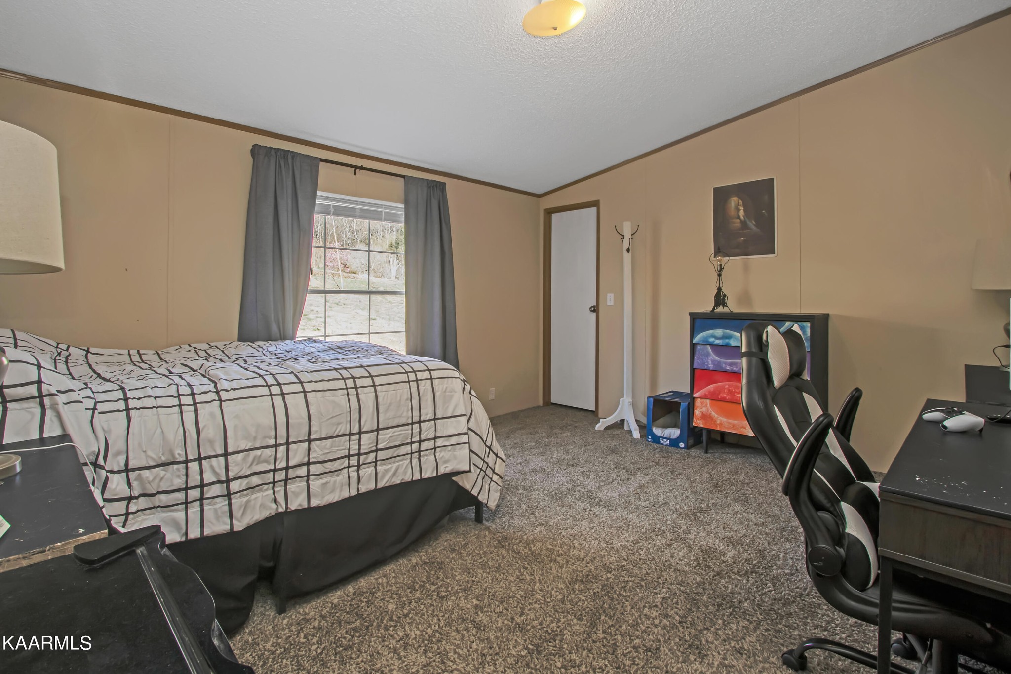 4981 Malone Road Loudon, TN 37774 - Photo 32 of 35 a bedroom with a bed and a desk