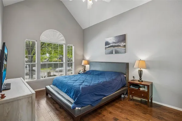 a bedroom with a bed and window