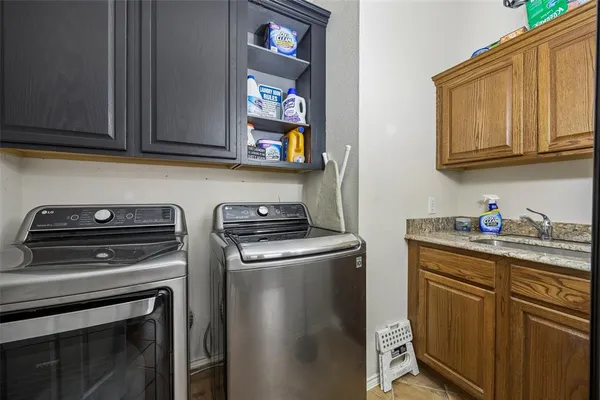 a kitchen with stainless steel appliances granite countertop a stove and a microwave