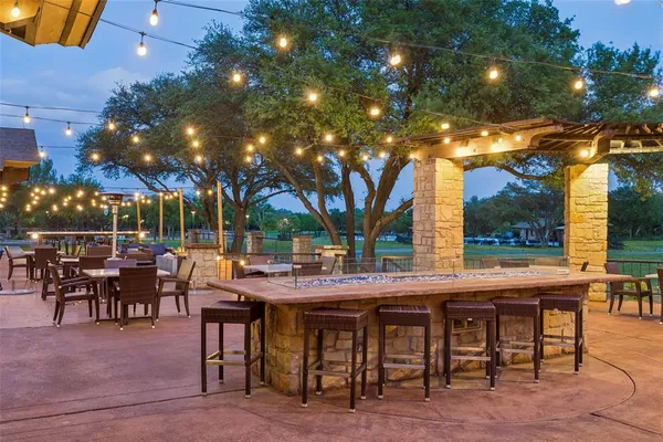 a view of a outdoor sitting area with furniture and garden