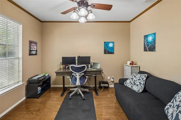 a living room with furniture a rug and a window