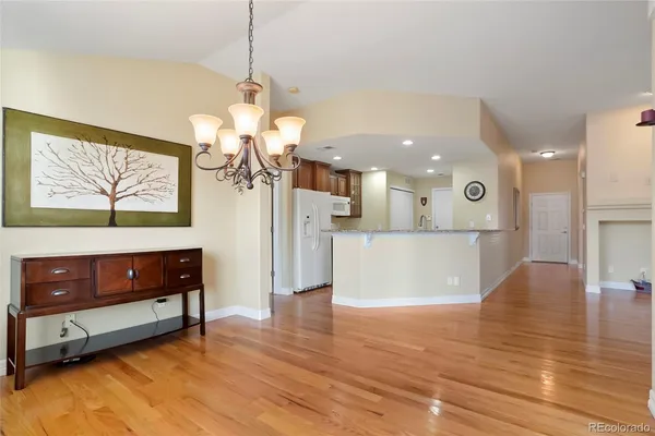 a view of kitchen with cabinets and wooden floor