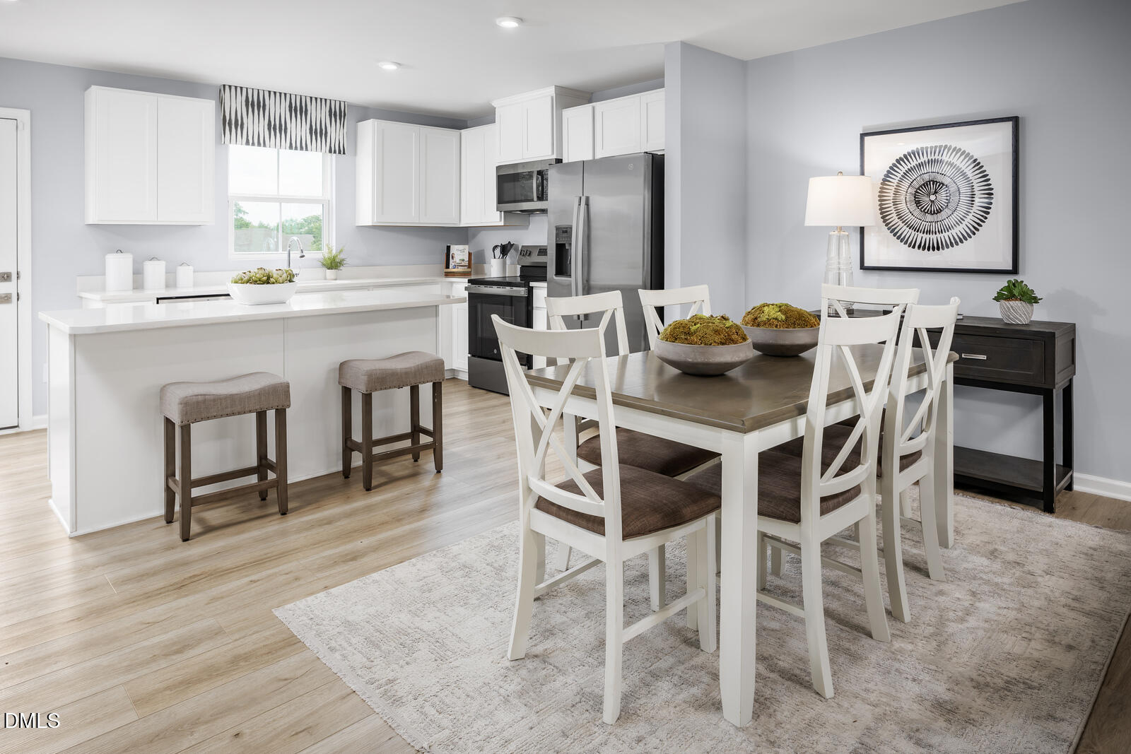 199 Brook Bawn Road Wendell, NC 27591 - Photo 8 of 25 a kitchen with stainless steel appliances granite countertop a dining table chairs refrigerator and sink