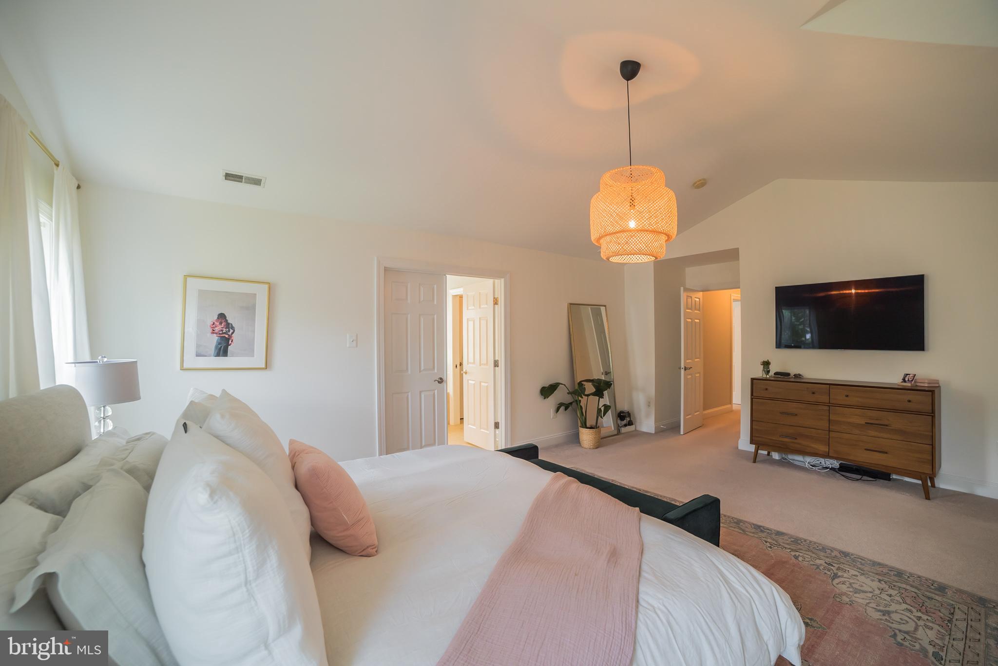 3746 Spring Meadow Drive Ellicott City, MD 21042 - Photo 13 of 40 a bedroom with bed and a flat tv screen