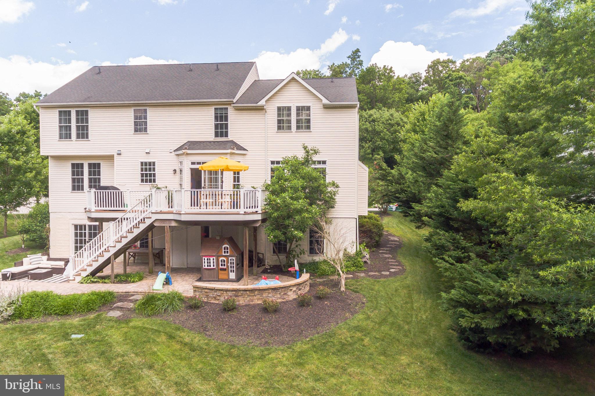 3746 Spring Meadow Drive Ellicott City, MD 21042 - Photo 2 of 40 a front view of a house with a yard