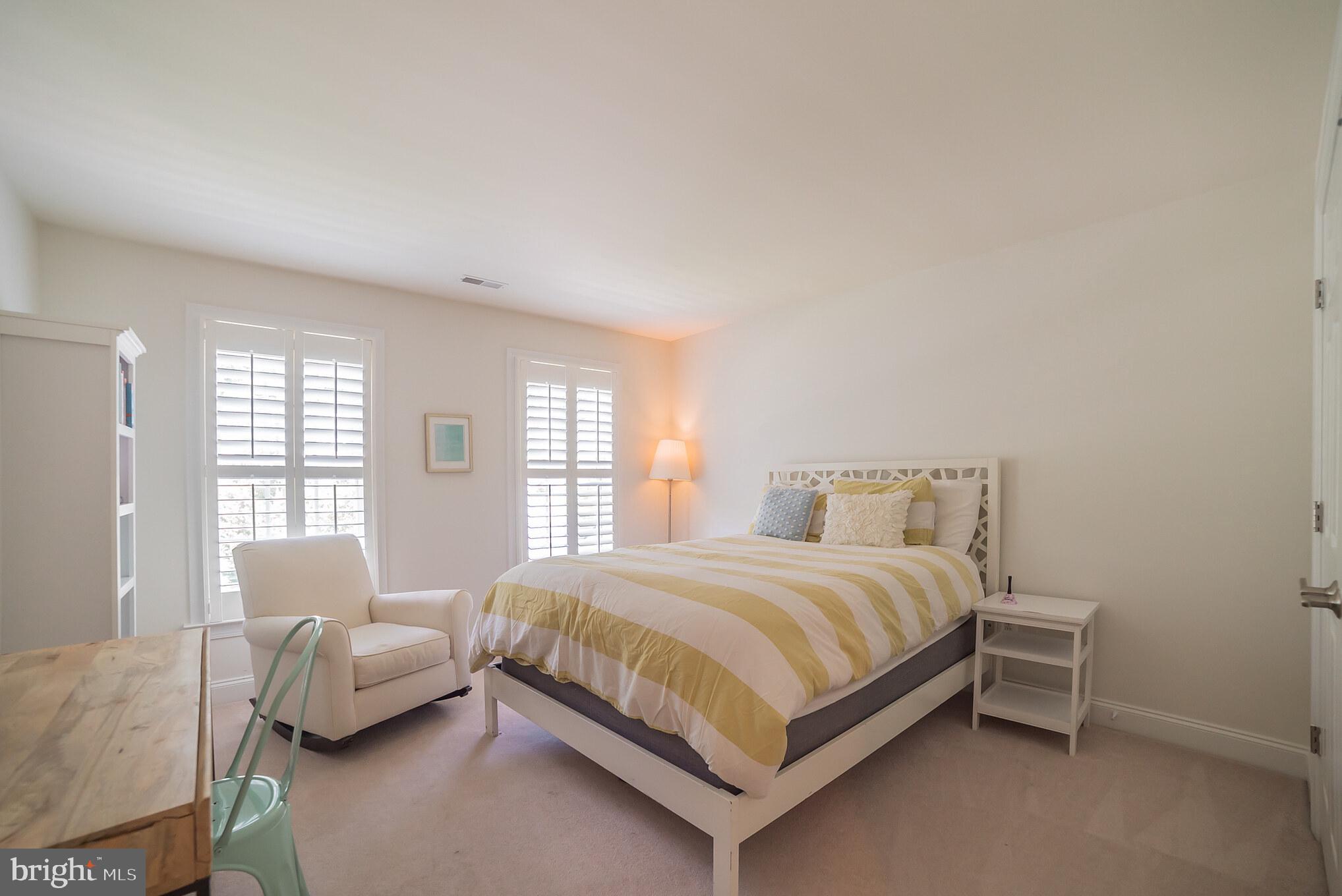 3746 Spring Meadow Drive Ellicott City, MD 21042 - Photo 32 of 40 a bedroom with a bed and window