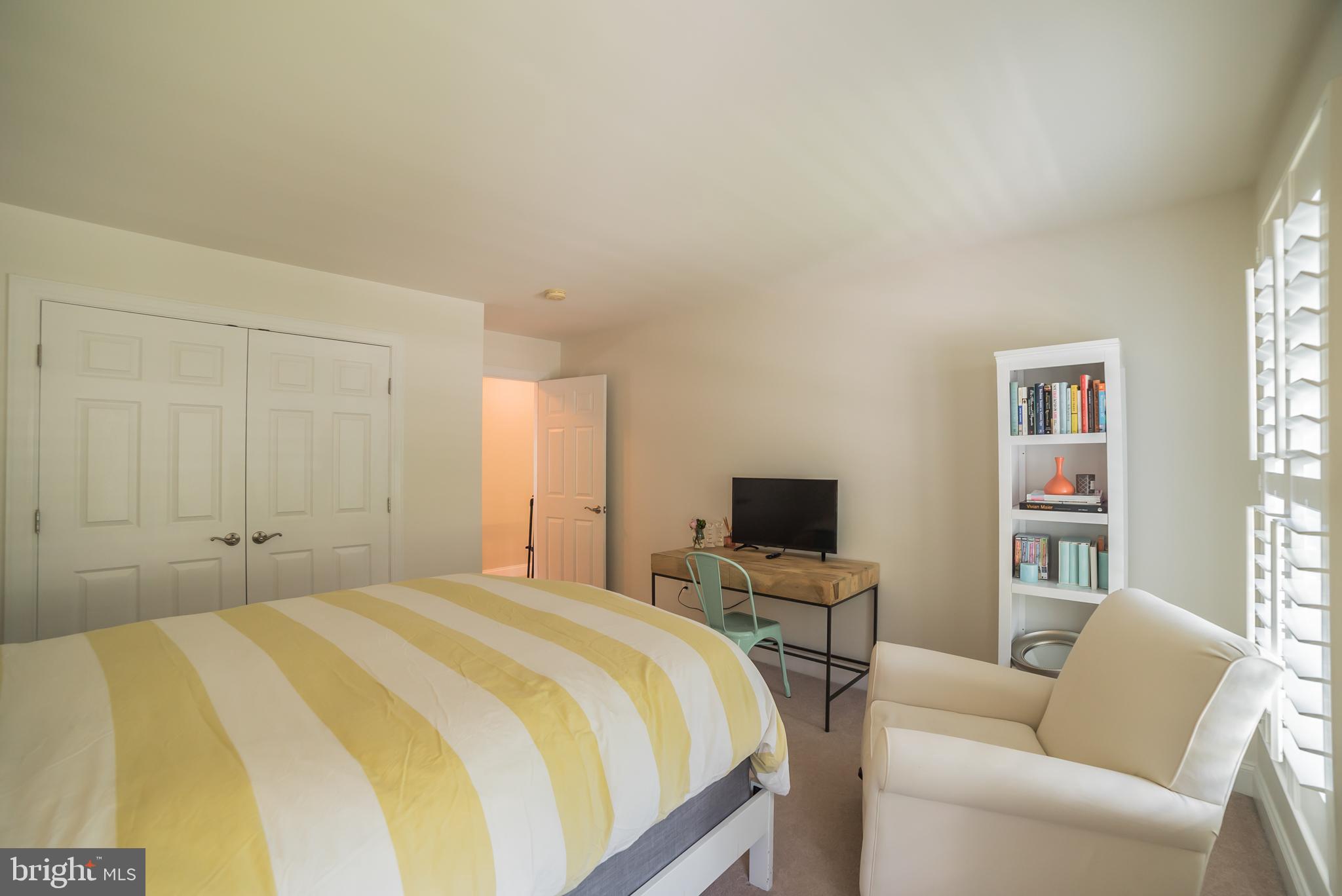 3746 Spring Meadow Drive Ellicott City, MD 21042 - Photo 33 of 40 a bedroom with a bed and a flat screen tv