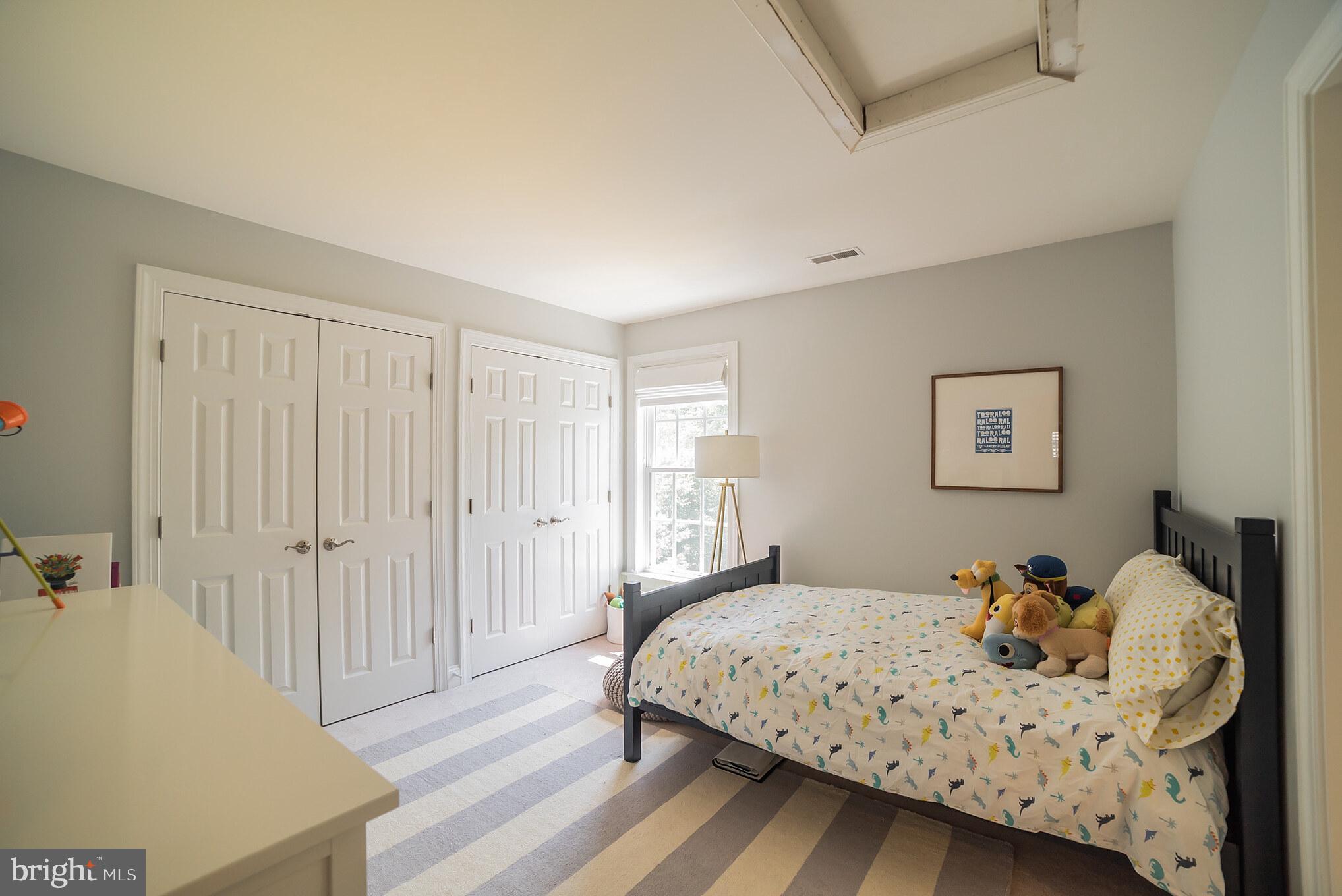 3746 Spring Meadow Drive Ellicott City, MD 21042 - Photo 34 of 40 a bedroom with a bed and a window