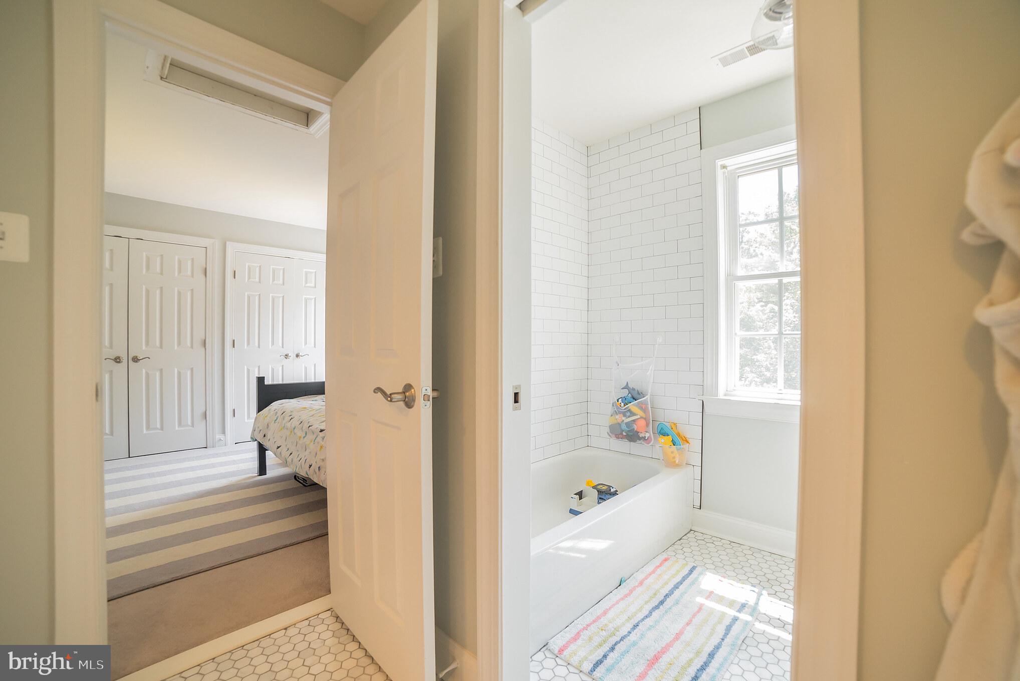 3746 Spring Meadow Drive Ellicott City, MD 21042 - Photo 36 of 40 a bathroom with a tub and shower view