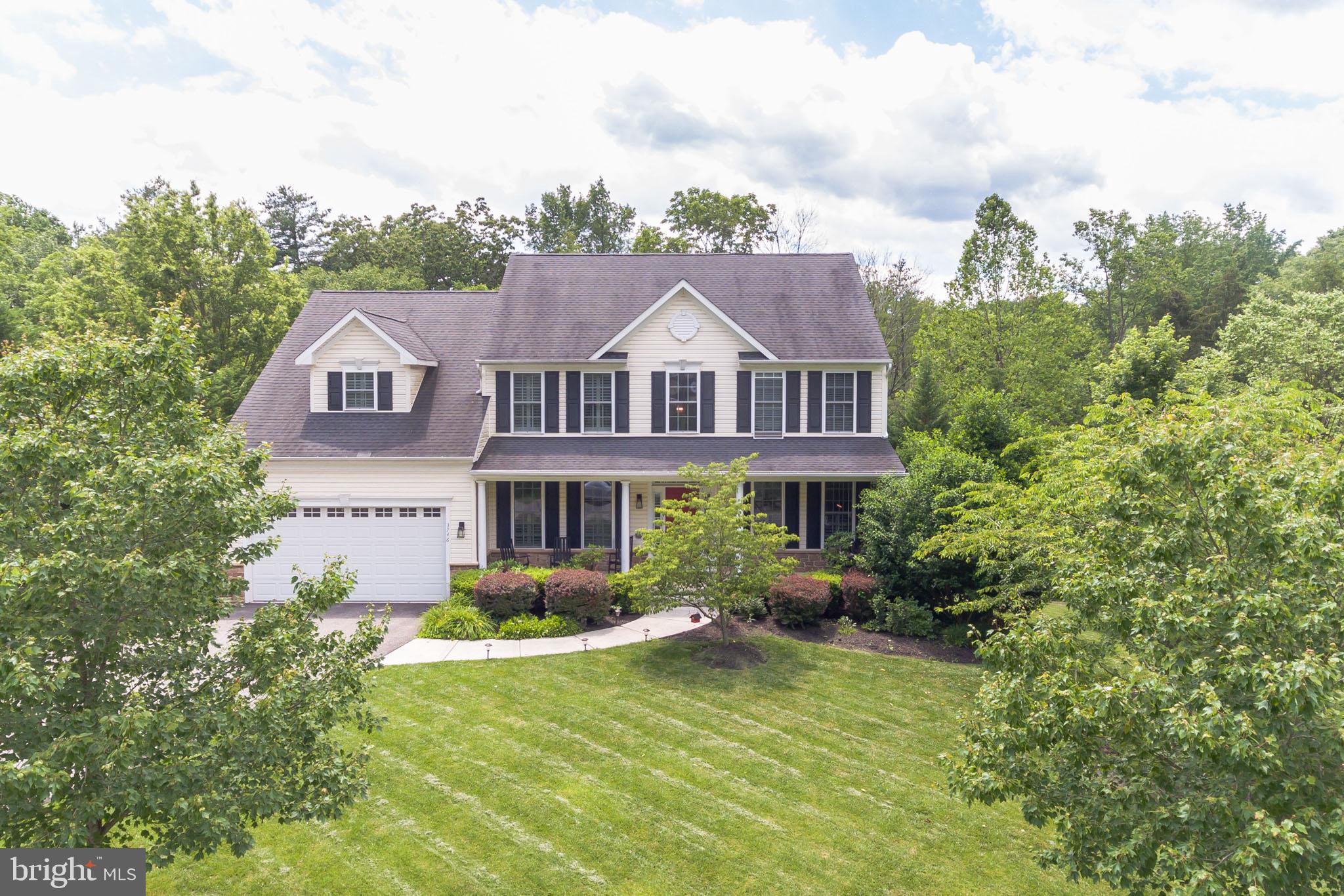 3746 Spring Meadow Drive Ellicott City, MD 21042 - Photo 37 of 40 a front view of a house with garden