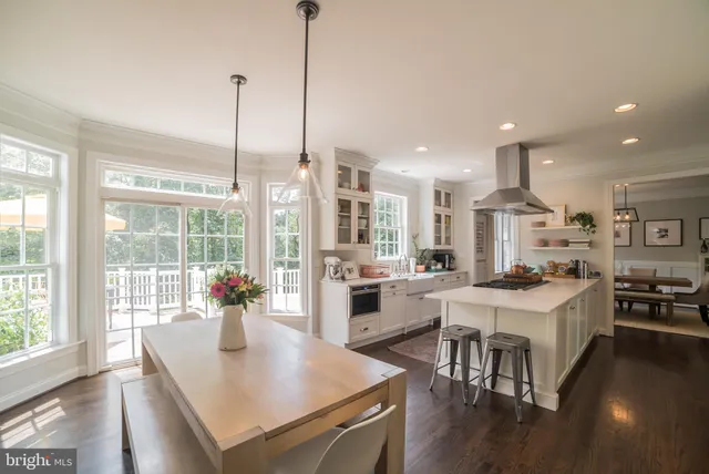 a view of kitchen and dining room with wooden floor