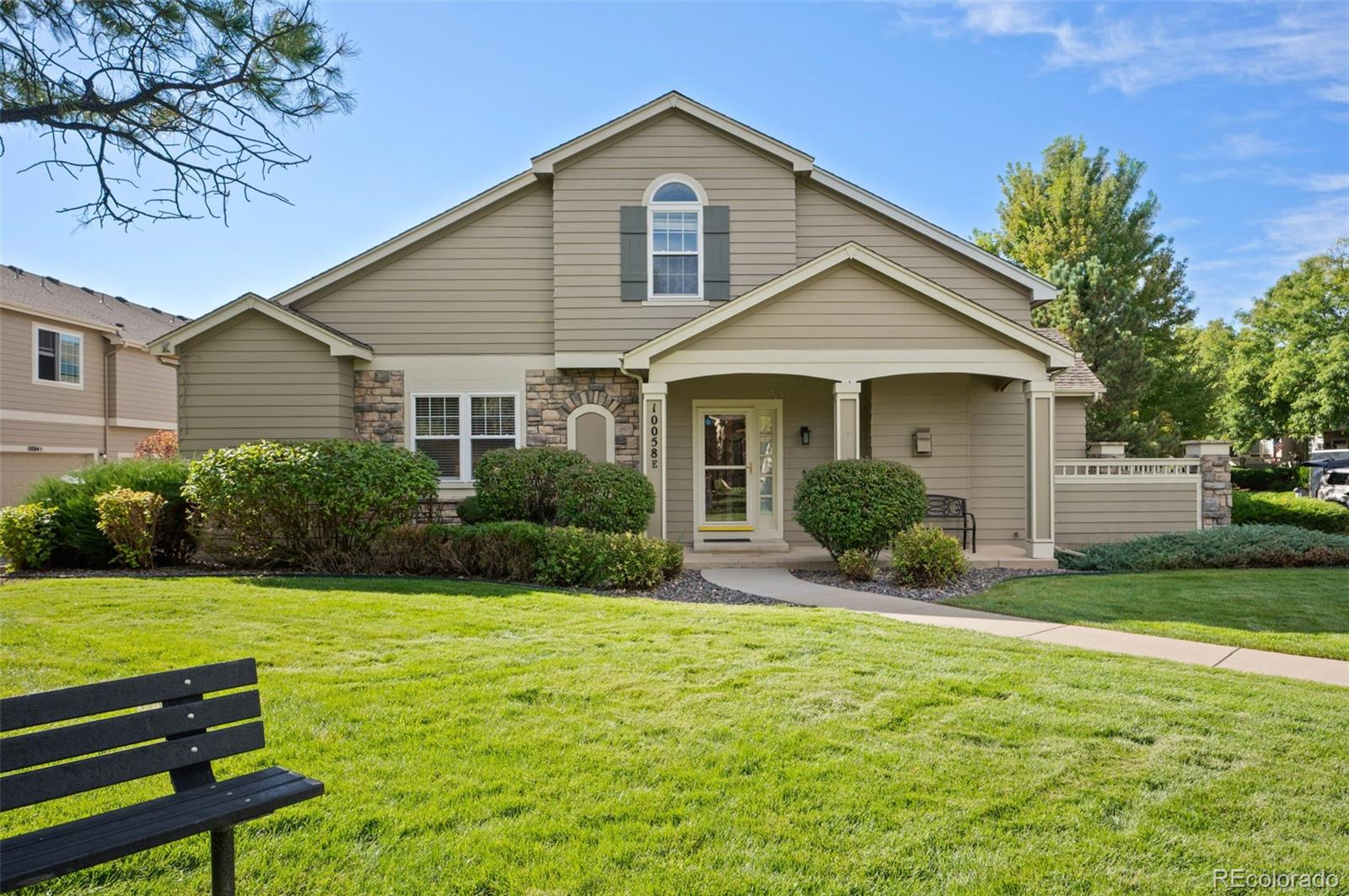 10058 Grove Court, Unit E Westminster, CO 80031 - Photo 1 of 48 a front view of a house with a yard