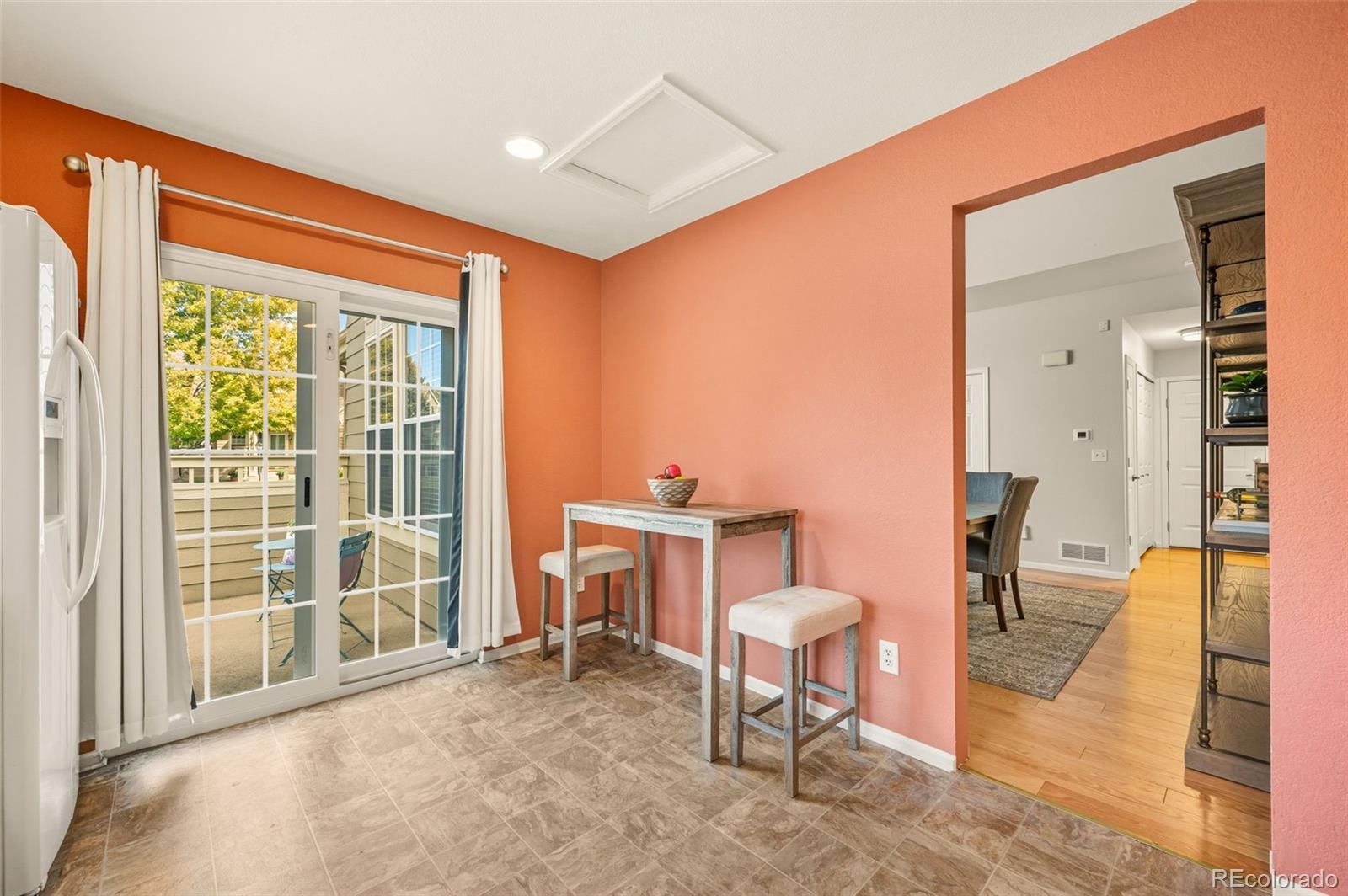 10058 Grove Court, Unit E Westminster, CO 80031 - Photo 14 of 48 a living room with furniture a rug and a large window