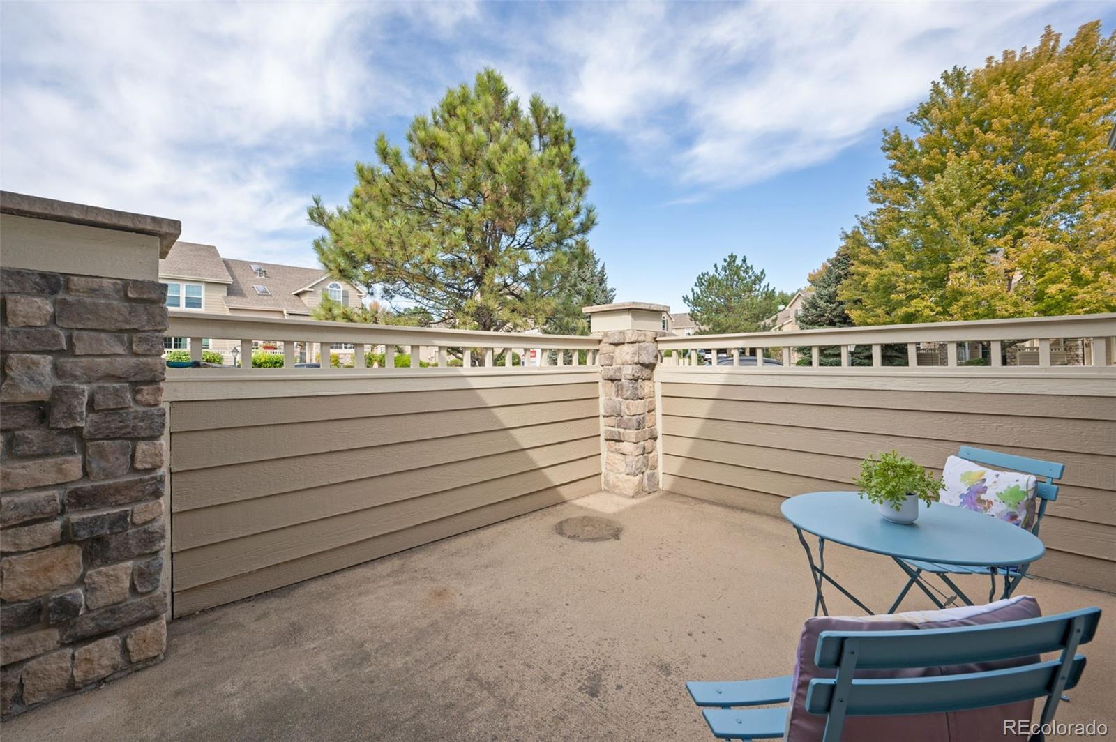 10058 Grove Court, Unit E Westminster, CO 80031 - Photo 15 of 48 a view of a chairs and table in a patio