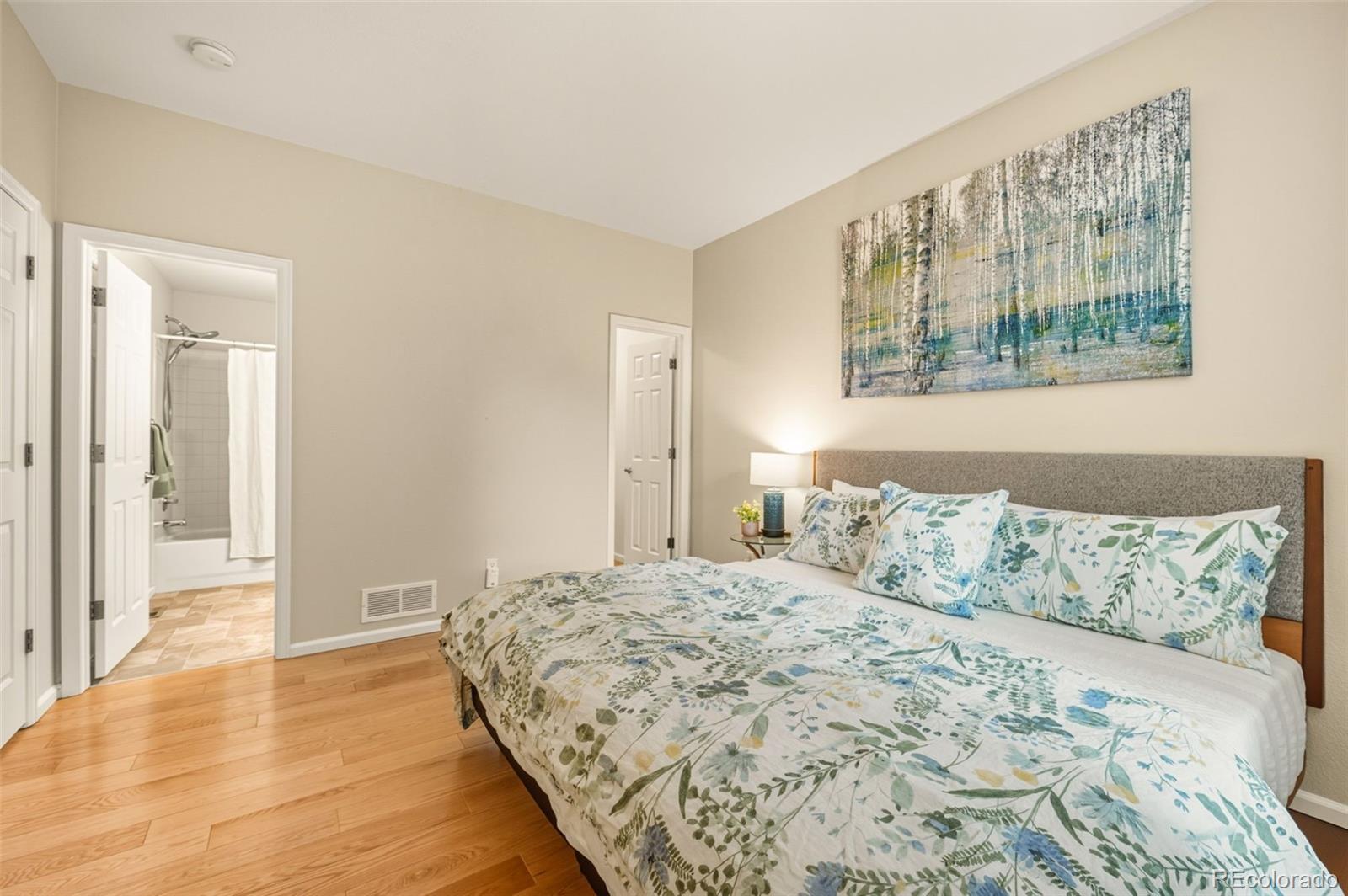 10058 Grove Court, Unit E Westminster, CO 80031 - Photo 23 of 48 a bedroom with a large bed and a window