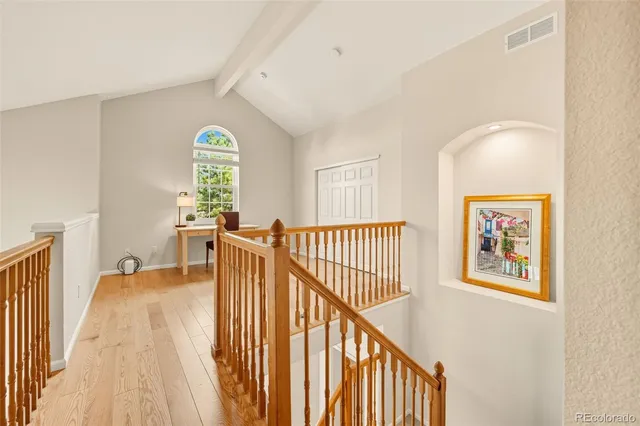 a view of a hallway with a window
