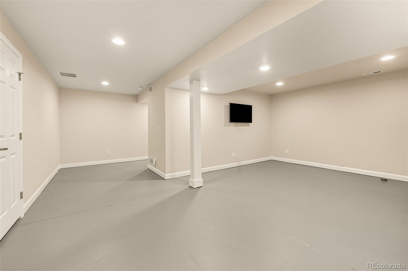 10058 Grove Court, Unit E Westminster, CO 80031 - Photo 34 of 48 an empty room with a empty space and windows